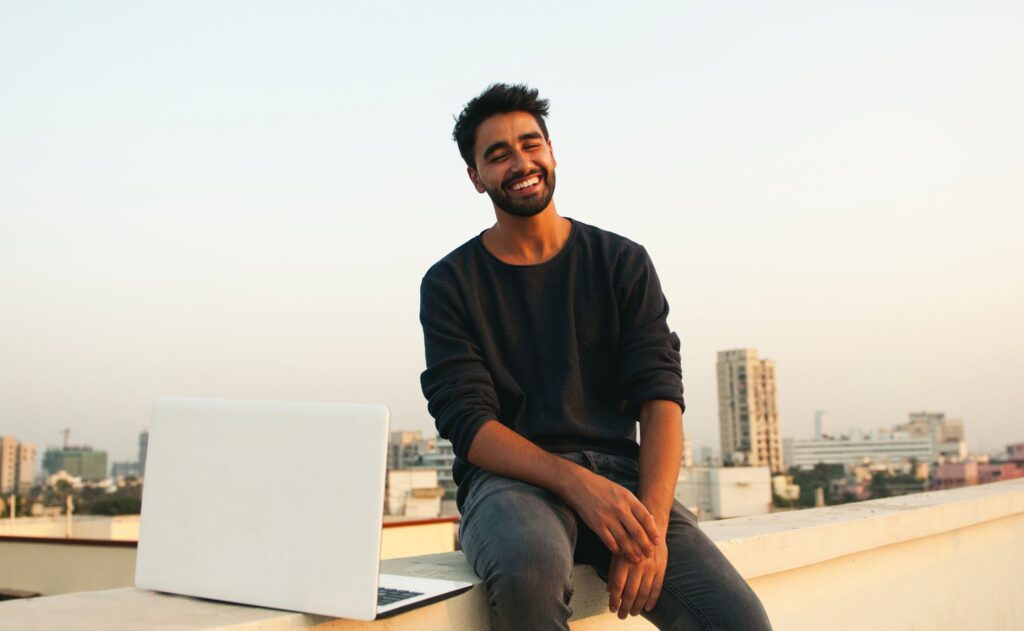 Picture of a handsome man using his notebook